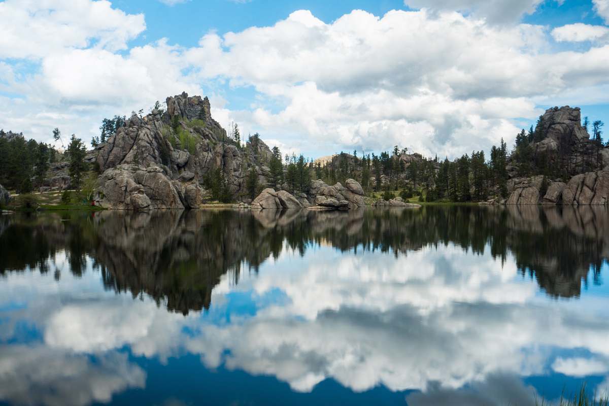 sylvan lake photography of body of water near mountain at daytime water